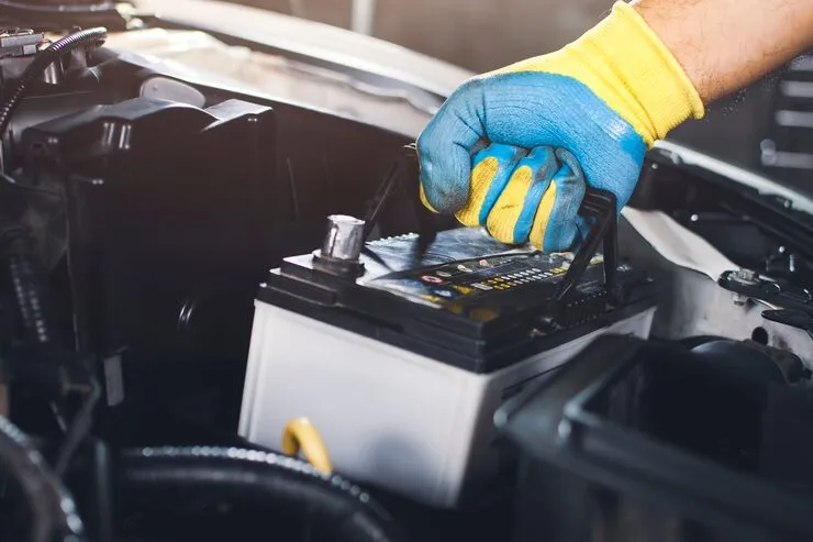 K1 technician replacing a car battery during mobile battery replacement service in Kent