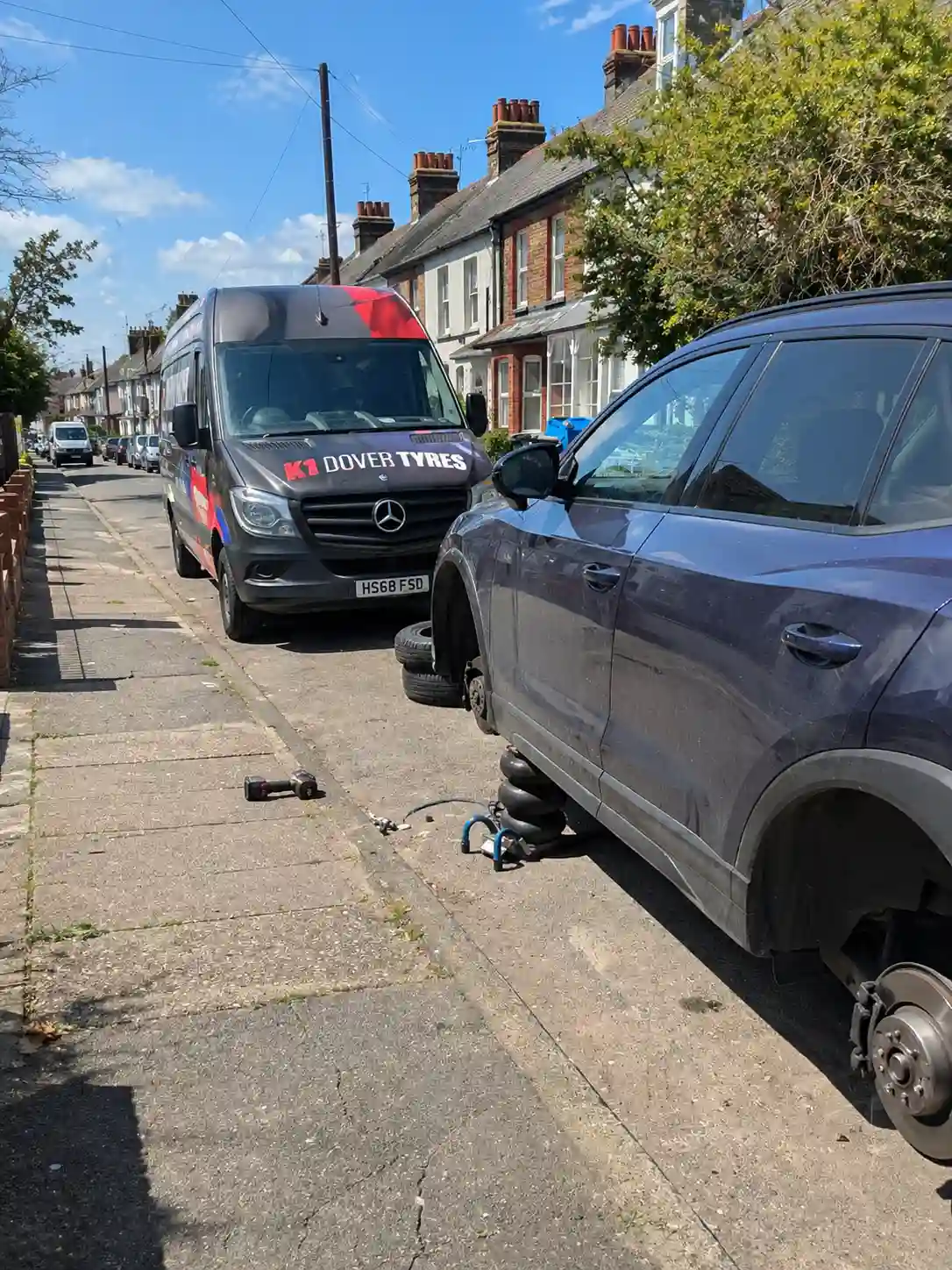 Mobile Tyre Fitting Chatham 11 Mobile tyre replacement service in Chatham Kent with car lifted and wheel removed on roadside