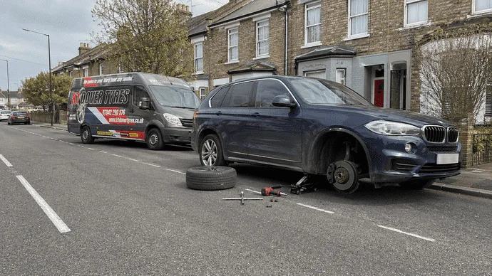 Same day mobile tyre fitting in Dartford Kent with car lifted and wheel removed for roadside tyre replacement
