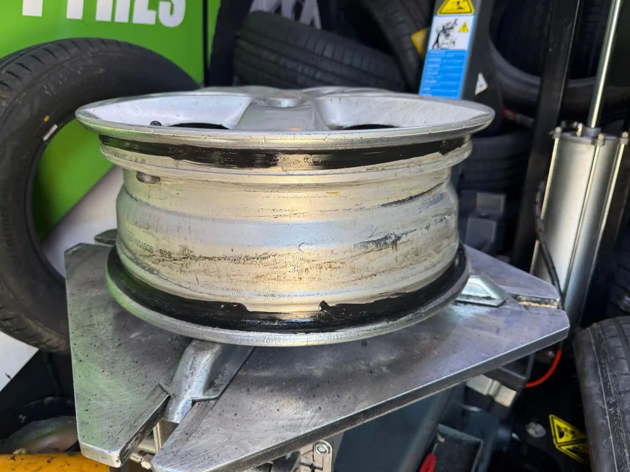 Mobile Tyre Fitting In Hougham 7 Wheel rim preparation process inside a mobile tyre fitting van during professional tyre replacement and roadside tyre fitting service.