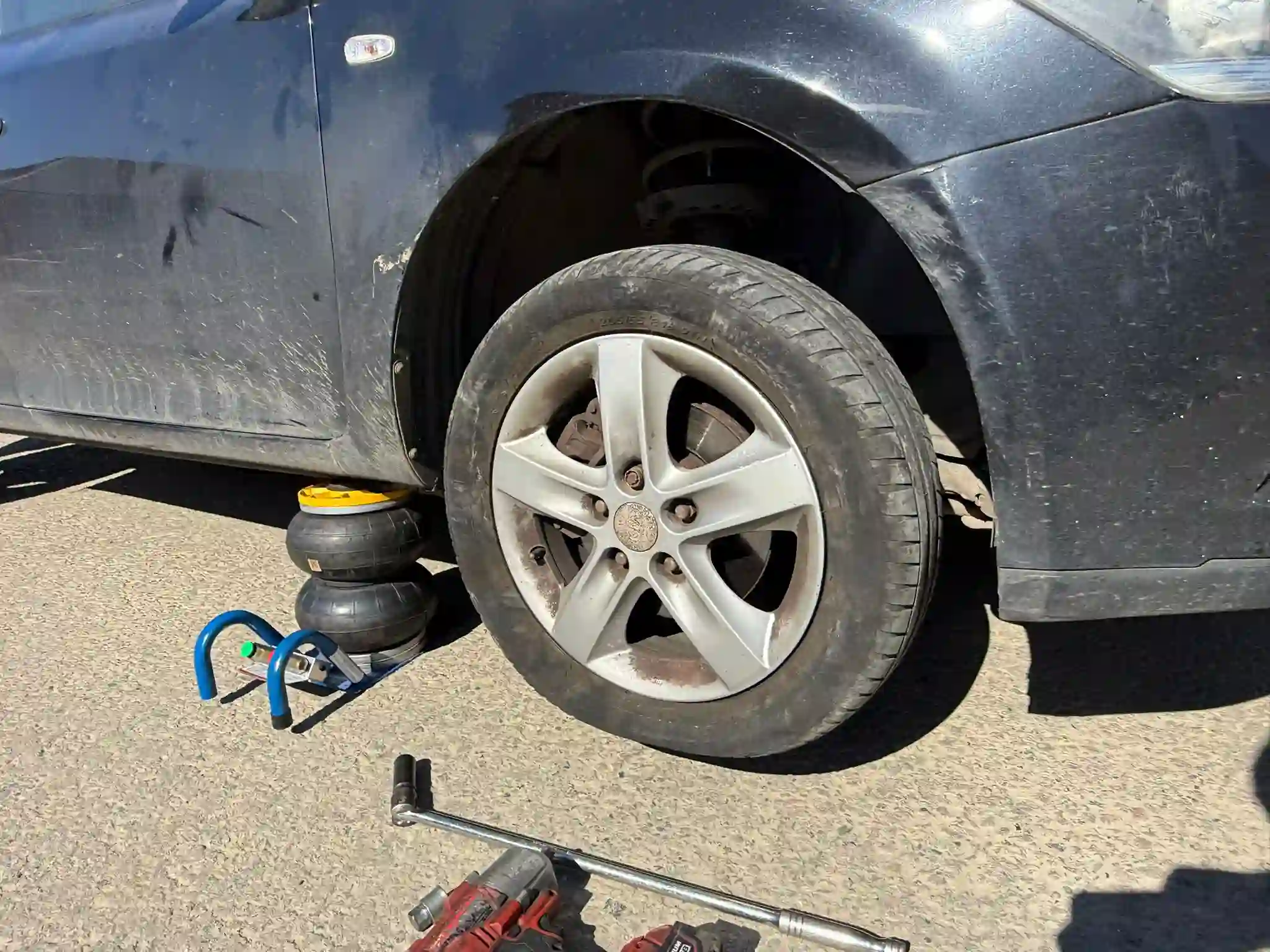 Mobile Tyre Fitting Kings Hill 12 Mobile Tyre Replacement in Progress – Car Lifted for Wheel Change at Customer Location